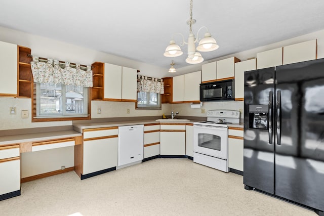 kitchen with a sink, a chandelier, open shelves, black appliances, and decorative light fixtures
