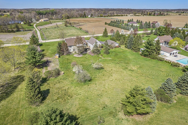 birds eye view of property featuring a rural view