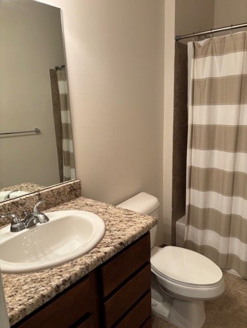 full bath with vanity, tile patterned flooring, and toilet