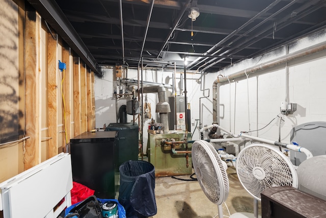 unfinished basement with fridge and water heater