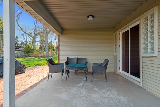 view of patio / terrace with fence and an outdoor living space