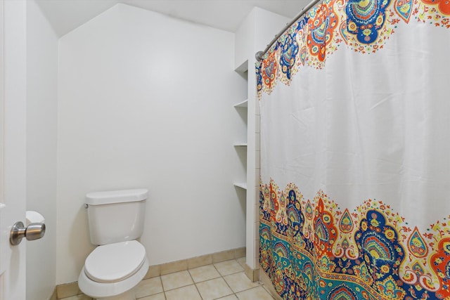 bathroom with baseboards, tile patterned flooring, a shower with curtain, and toilet