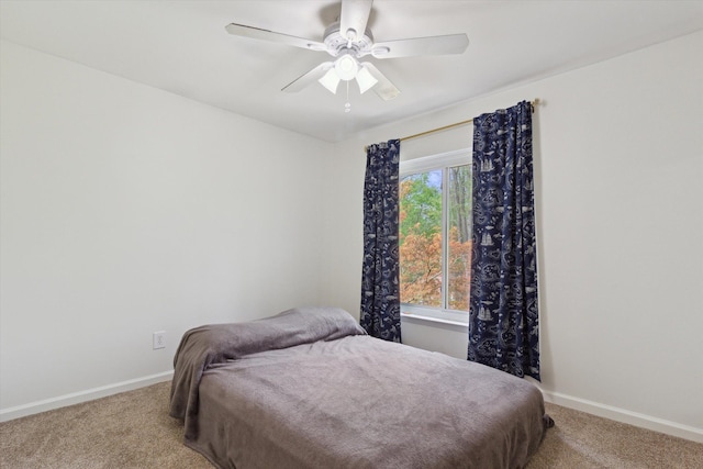 bedroom with carpet floors, a ceiling fan, and baseboards