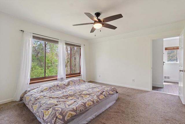 bedroom with carpet flooring, baseboards, and visible vents