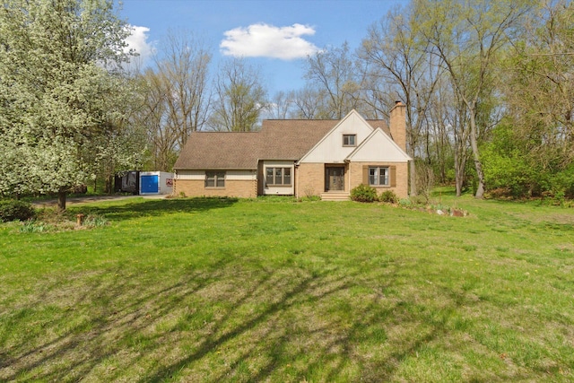traditional home with a chimney and a front lawn