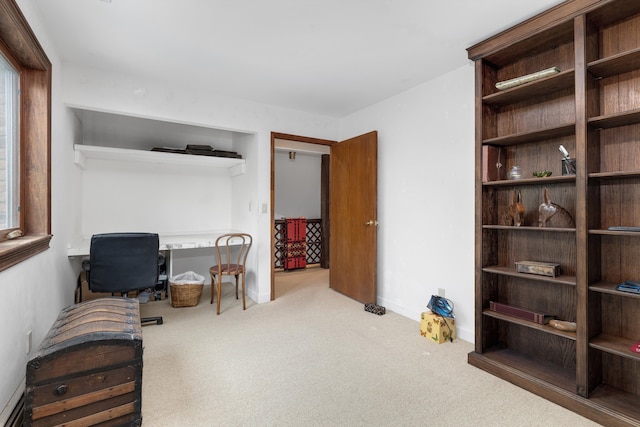 office space with baseboards and carpet