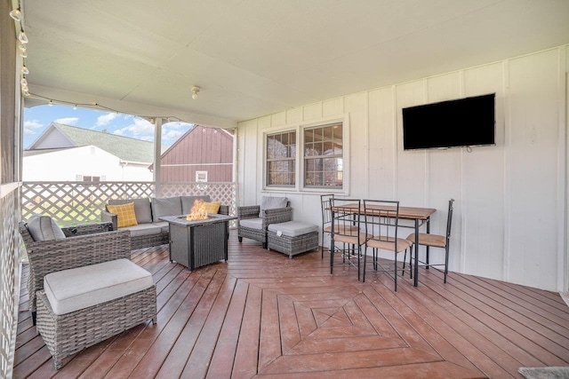 1016 Argyle Ct, Alma, MI 48801 - deck featuring an outdoor living space with a fire pit