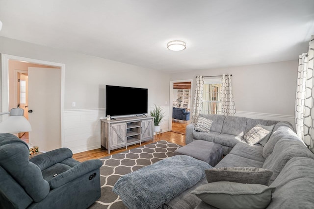 1016 Argyle Ct, Alma, MI 48801 - living area featuring wainscoting and wood finished floors