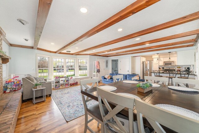 1016 Argyle Ct, Alma, MI 48801 - dining area with recessed lighting, french doors, light wood-type flooring, and beam ceiling