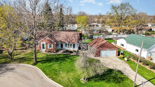 1016 Argyle Ct, Alma, MI 48801 - single story home featuring a garage, a front lawn, a residential view, and concrete driveway