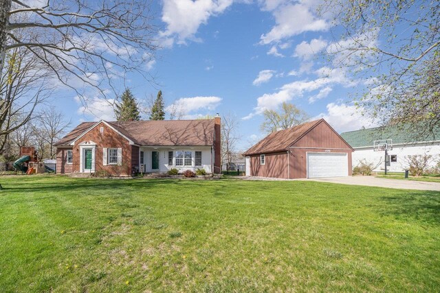 1016 Argyle Ct, Alma, MI 48801 - ranch-style home with a chimney, an outbuilding, a garage, a front lawn, and concrete driveway