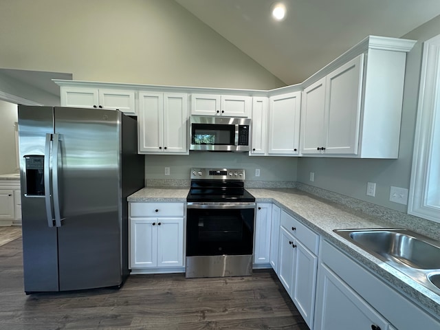 1052 Angle Rd, Lapeer, MI 48446 - kitchen with light countertops, dark wood finished floors, white cabinets, and stainless steel appliances