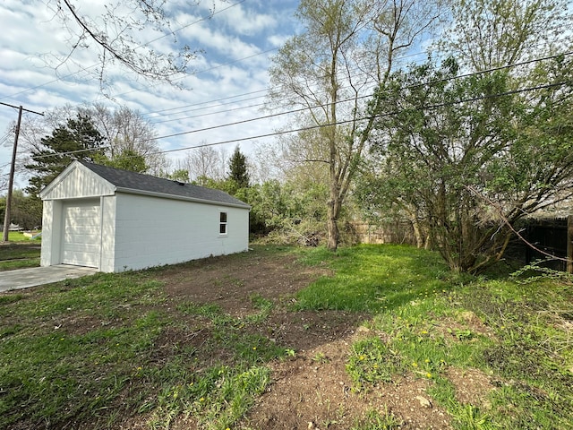 1052 Angle Rd, Lapeer, MI 48446 - view of yard featuring a garage, an outbuilding, and concrete driveway