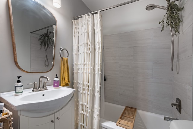 full bathroom with vanity, toilet, and shower / tub combo with curtain