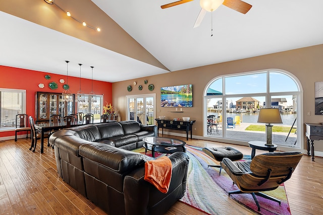 32560 N River Rd, Harrison Township, MI 48045 - living area featuring hardwood / wood-style flooring, plenty of natural light, a ceiling fan, and high vaulted ceiling