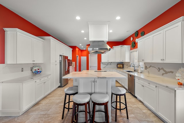 32560 N River Rd, Harrison Township, MI 48045 - kitchen featuring appliances with stainless steel finishes, white cabinetry, a breakfast bar area, a center island, and recessed lighting