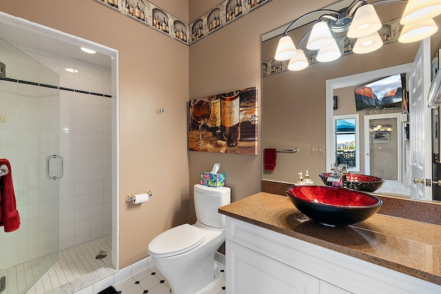 32560 N River Rd, Harrison Township, MI 48045 - bathroom featuring toilet, a stall shower, vanity, and tile patterned floors