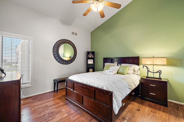 32560 N River Rd, Harrison Township, MI 48045 - bedroom with baseboards, wood finished floors, high vaulted ceiling, and ceiling fan