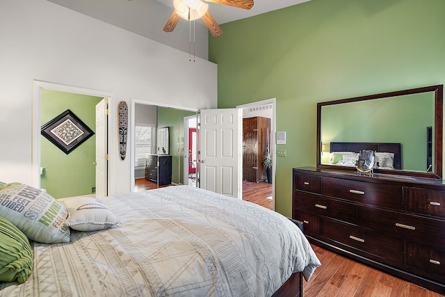 32560 N River Rd, Harrison Township, MI 48045 - bedroom featuring a towering ceiling, wood finished floors, and connected bathroom