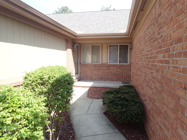 46980 Country Ln Unit 8, Macomb, MI 48044 - exterior space featuring brick siding and a shingled roof
