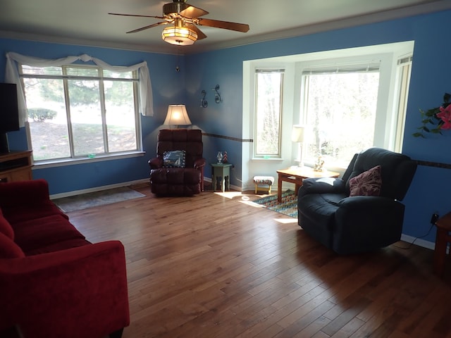 46980 Country Ln Unit 8, Macomb, MI 48044 - living room with crown molding, a ceiling fan, baseboards, and wood-type flooring