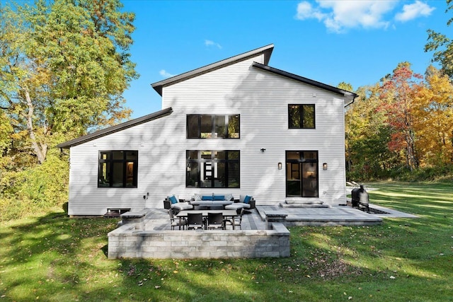 back of house with a lawn, a patio, and outdoor lounge area