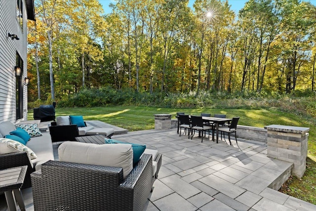view of patio featuring outdoor dining area, an outdoor hangout area, and area for grilling