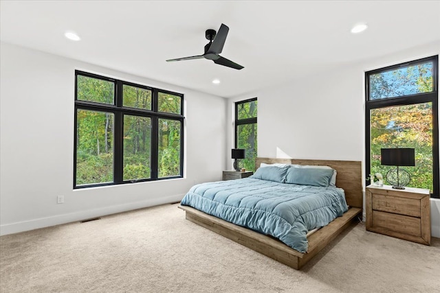 bedroom with visible vents, light carpet, baseboards, ceiling fan, and recessed lighting