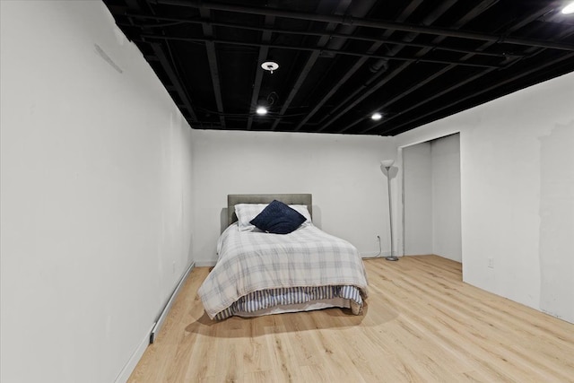 bedroom featuring wood finished floors