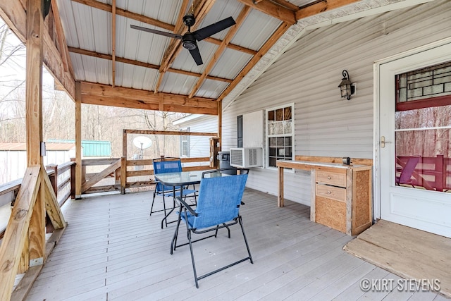 wooden deck with a ceiling fan, outdoor dining area, and cooling unit