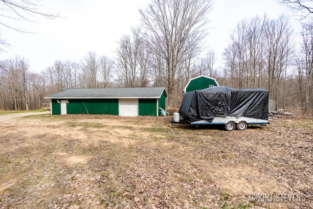 view of yard featuring an outbuilding and an outdoor structure