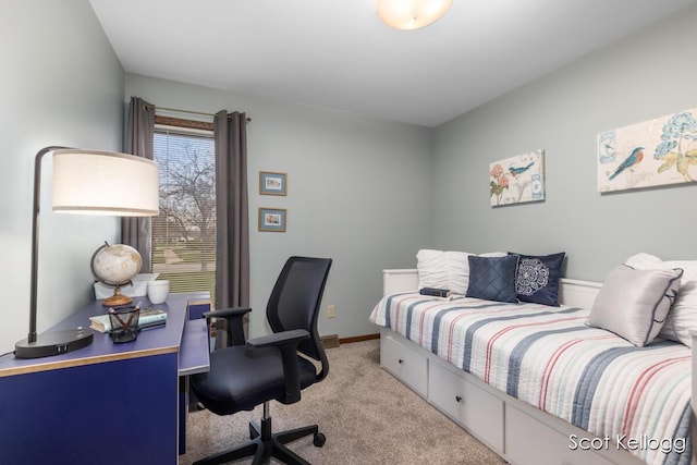 carpeted bedroom with baseboards