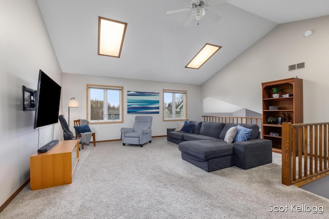 carpeted living area with a ceiling fan, visible vents, lofted ceiling, and baseboards