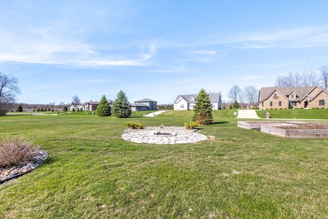 view of yard with an outdoor fire pit