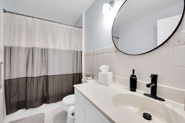 73941 Madison St, Armada, MI 48005 - bathroom with toilet, tile walls, wainscoting, and vanity