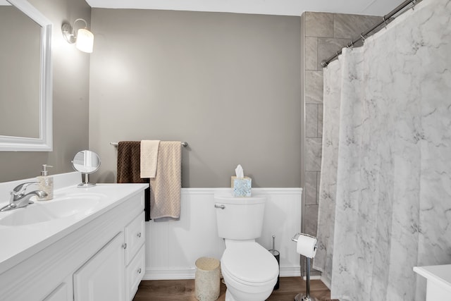 73941 Madison St, Armada, MI 48005 - full bath featuring curtained shower, wood finished floors, a wainscoted wall, vanity, and toilet