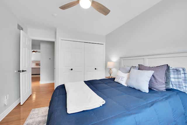 73941 Madison St, Armada, MI 48005 - bedroom featuring a ceiling fan, visible vents, wood finished floors, baseboards, and a closet