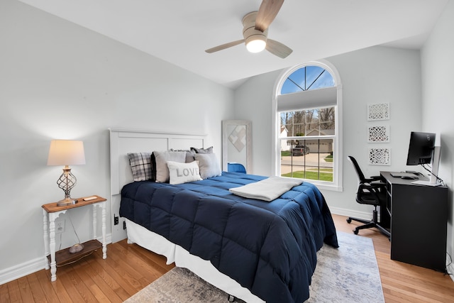 73941 Madison St, Armada, MI 48005 - bedroom featuring baseboards, lofted ceiling, multiple windows, and light wood finished floors