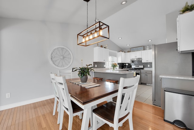 73941 Madison St, Armada, MI 48005 - dining space with recessed lighting, light wood finished floors, lofted ceiling, and a notable chandelier