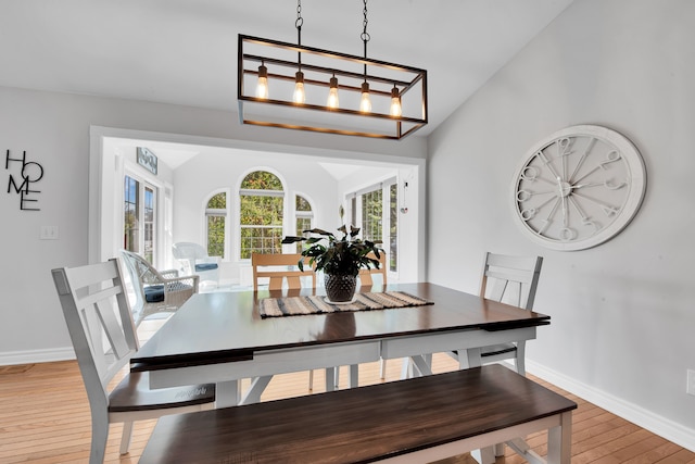 73941 Madison St, Armada, MI 48005 - dining room featuring baseboards, vaulted ceiling, and wood finished floors