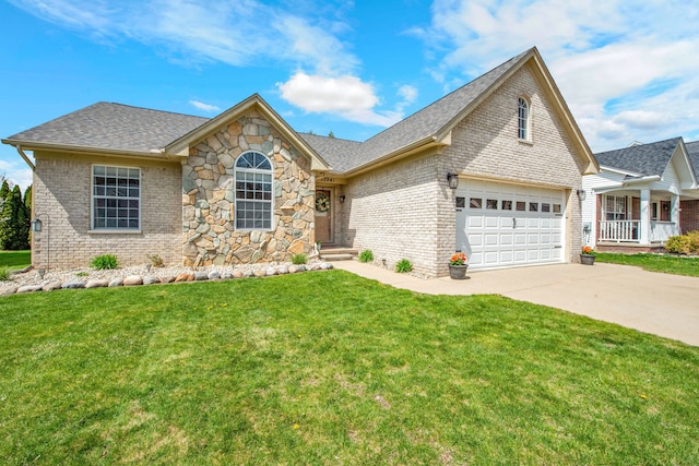 73941 Madison St, Armada, MI 48005 - view of front of property featuring concrete driveway, brick siding, a front yard, and roof with shingles