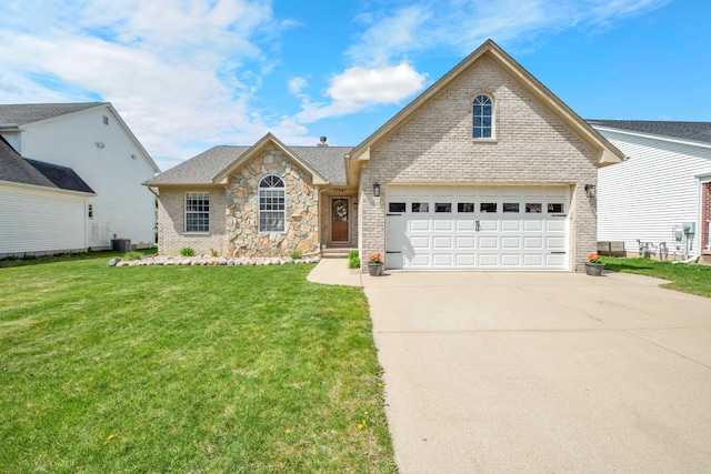 73941 Madison St, Armada, MI 48005 - view of front of house with brick siding, a garage, a front yard, and concrete driveway