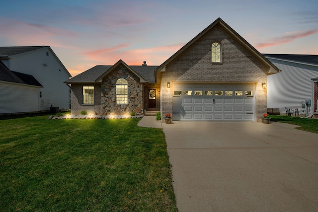 73941 Madison St, Armada, MI 48005 - view of front of house featuring a lawn, brick siding, central AC, and driveway
