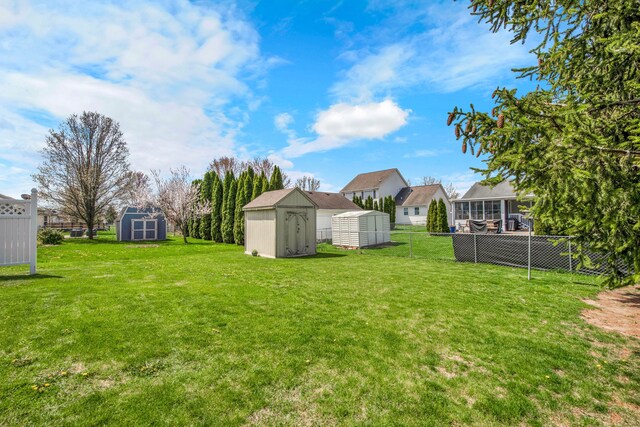 73941 Madison St, Armada, MI 48005 - view of yard with an outdoor structure, a shed, and fence