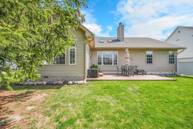 73941 Madison St, Armada, MI 48005 - rear view of house with a chimney, a shingled roof, a patio area, crawl space, and a yard