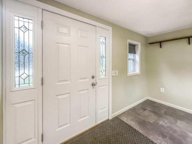 entrance foyer featuring baseboards
