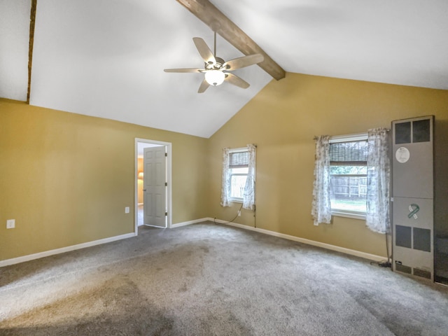 empty room featuring ceiling fan, carpet floors, a heating unit, baseboards, and vaulted ceiling with beams