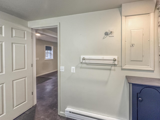bathroom with baseboards, baseboard heating, and electric panel