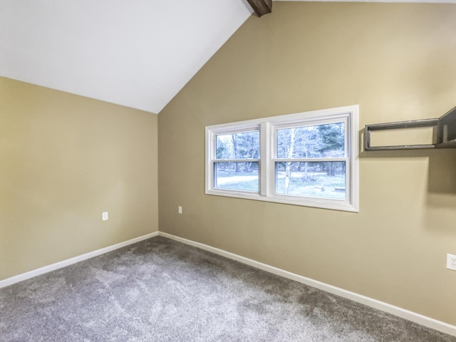interior space featuring baseboards, carpet flooring, and lofted ceiling with beams