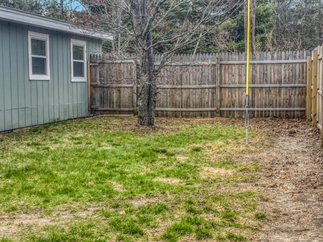 view of yard with a fenced backyard